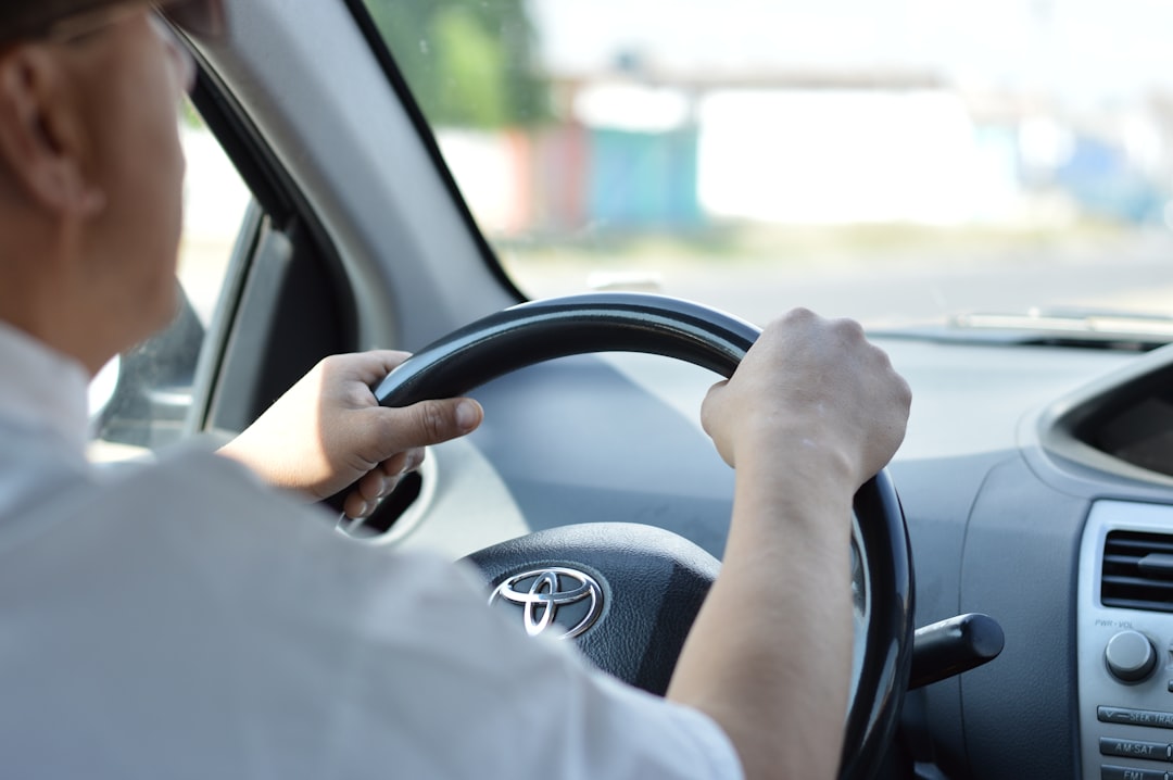 Hand on steering wheel